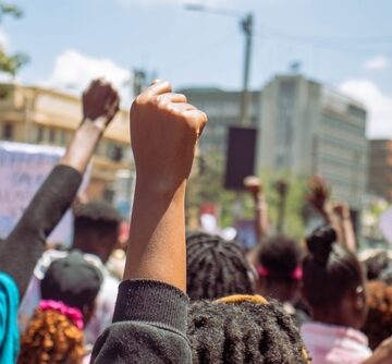 Anti-femicide protesters marching on the streets in Nairobi, Kenya. Anti-femicide protesters marching on the streets in Nairobi, Kenya.
