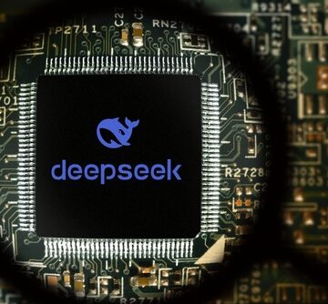 A processor chip bearing the DeepSeek AI logo viewed through a magnifying glass. A processor chip bearing the DeepSeek AI logo viewed through a magnifying glass.