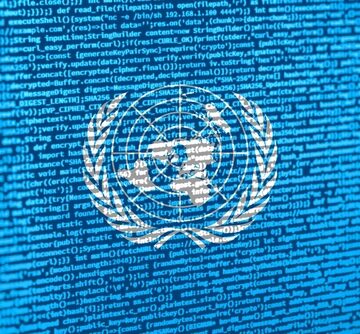 The United Nations (UN) official emblem overlaid onto a background of digital computer code.