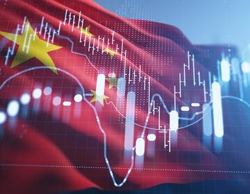 Financial concept image of the flag of the People's Republic of China with a stock market candlestick chart and technical trend lines. Financial concept image of the flag of the People's Republic of China with a stock market candlestick chart and technical trend lines.