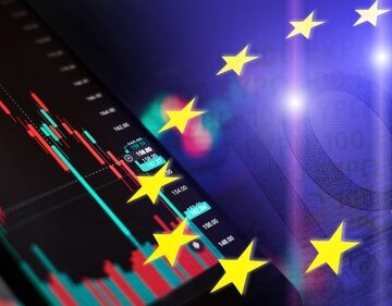 Digital concept image highlights European financial markets, depicting a digital candlestick chart on a smartphone overlaid with the stars of the European Union flag.