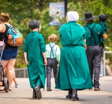 An Amish family, in traditional green clothing, on a day out in Minneapolis, Minnesota.