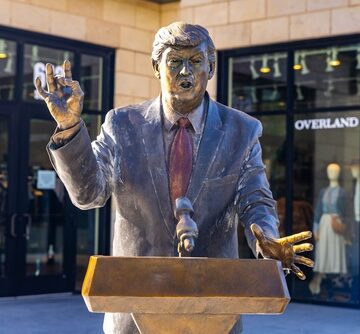 THE EMPIRE IS CARVING IDOLS WHILE AMERICA BURNS