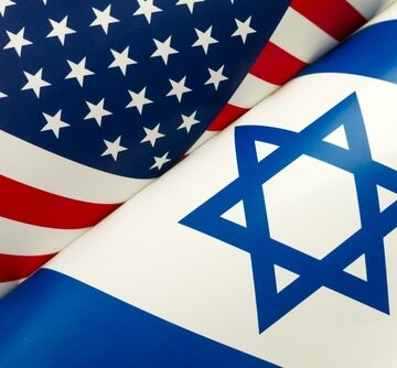 The furled national flags of the United States and Israel displayed side-by-side. The furled national flags of the United States and Israel displayed side-by-side.