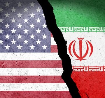 Flag,Of,Usa,And,Iran,Painted,On,A,Concrete,Wall TRUMP CHANGES IRAN WAR GOALS