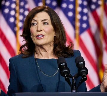 Kathy Hochul, the 57th Governor of New York, speaking at a public event. Kathy Hochul, the 57th Governor of New York, speaking at a public event.