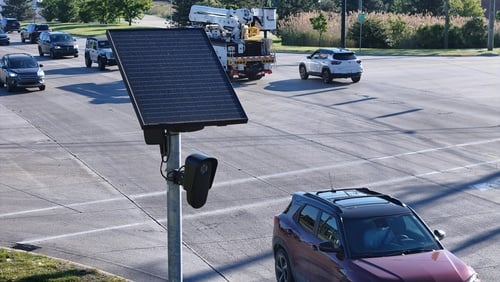 A Flock Safety automatic license plate reader (ALPR) camera, often used by law enforcement to track vehicle movements.