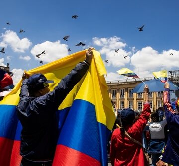 Protesters waving the Colombian flag during a peaceful demonstration in Bogotá, Colombia, where protesters gathered to oppose government reforms proposed by President Gustavo Petro. Protesters waving the Colombian flag during a peaceful demonstration in Bogotá, Colombia, where protesters gathered to oppose government reforms proposed by President Gustavo Petro.