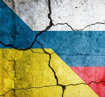 Ukrainian,And,Russian,Flags,On,A,Cracked,Wall.,A,Symbol GRIM MILESTONE: TWO MILLION KILLED IN WAR BETWEEN RUSSIA AND UKRAINE