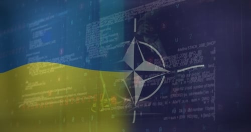 The NATO logo superimposed over images of computer screens. The NATO logo superimposed over images of computer screens.