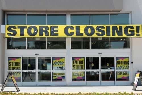 A retail storefront displaying "Store Closing" sign in Lake Forest, California. A retail storefront displaying "Store Closing" sign in Lake Forest, California.