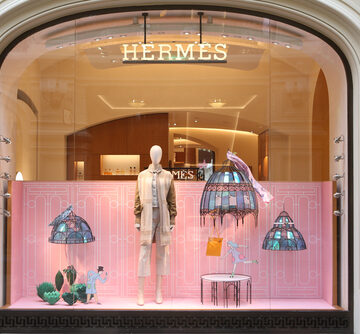 The Hermès boutique window display in the GUM department store in Moscow, featuring whimsical sculpted lighting and textured walls. The Hermès boutique window display in the GUM department store in Moscow, featuring whimsical sculpted lighting and textured walls.