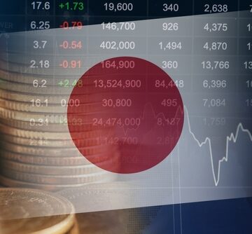 A graphic of the Japanese flag overlaid with financial stock market data, currency stacks, and a trend line graph. A graphic of the Japanese flag overlaid with financial stock market data, currency stacks, and a trend line graph.