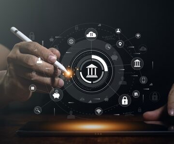 Digital banking and fintech platform concept image showing interactive HUD overlays and touchscreens to visualize core banking, data security, and global financial connectivity. Digital banking and fintech platform concept image showing interactive HUD overlays and touchscreens to visualize core banking, data security, and global financial connectivity.
