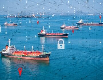 Multiple cargo ships and oil tankers navigating open waters, overlaid with a digital graphic network of padlocks and geographic location pins. Multiple cargo ships and oil tankers navigating open waters, overlaid with a digital graphic network of padlocks and geographic location pins.