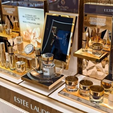A luxury retail display counter showcasing skincare products from the Estée Lauder Re-Nutriv collection. A luxury retail display counter showcasing skincare products from the Estée Lauder Re-Nutriv collection.