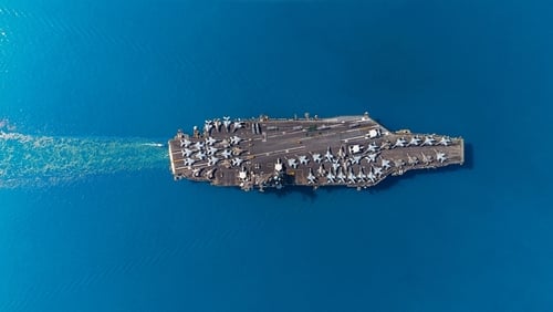 Aerial,Top,View,Military,Navy,Ship,Carrier,At,Sea. U.S. CARRIERS IMPACTED BY DESTRUCTION OF BAHRAIN BASE DURING IRAN WAR: REPORT