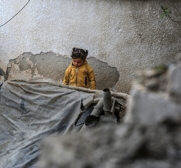 A child stands in the remains of a building in Rafah, Gaza, in the aftermath of an Israeli airstrike. A child stands in the remains of a building in Rafah, Gaza, in the aftermath of an Israeli airstrike.