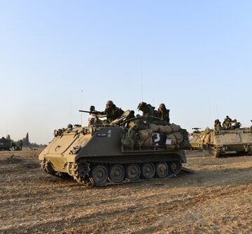A contingent of M113 armored personnel carriers utilized by the Israel Defense Forces (IDF) to transport soldiers near the Gaza Strip. A contingent of M113 armored personnel carriers utilized by the Israel Defense Forces (IDF) to transport soldiers near the Gaza Strip.