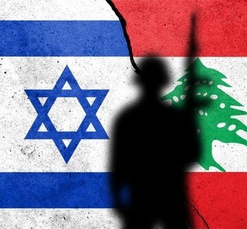Conceptual image of the flags of Israel and Lebanon separated by a fracture and shadowed by a soldier.