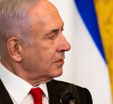 Prime Minister Benjamin Netanyahu wearing a yellow ribbon lapel pin, a symbol used to call for the return of hostages held in Gaza. Prime Minister Benjamin Netanyahu wearing a yellow ribbon lapel pin, a symbol used to call for the return of hostages held in Gaza.
