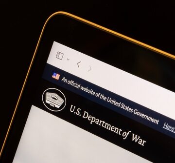 A computer screen displaying a mock or satirical landing page for a fictional "U.S. Department of War," playing on the historic designation used before the creation of the Department of Defense in 1949. A computer screen displaying a mock or satirical landing page for a fictional "U.S. Department of War," playing on the historic designation used before the creation of the Department of Defense in 1949.