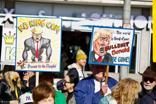 A political rally in Frankfurt, Germany, on October 18, 2025, shows demonstrators holding signs criticizing Donald Trump. A political rally in Frankfurt, Germany, on October 18, 2025, shows demonstrators holding signs criticizing Donald Trump.