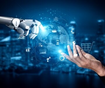 Digital image of a robotic hand reaching out to a human hand with various business icons displayed between the hands. Digital image of a robotic hand reaching out to a human hand with various business icons displayed between the hands.