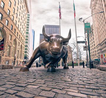 The iconic Charging Bull bronze sculpture (also known as the Wall Street Bull) is located in the Financial District of Lower Manhattan in New York City, just north of Bowling Green Park. The iconic Charging Bull bronze sculpture (also known as the Wall Street Bull) is located in the Financial District of Lower Manhattan in New York City, just north of Bowling Green Park.