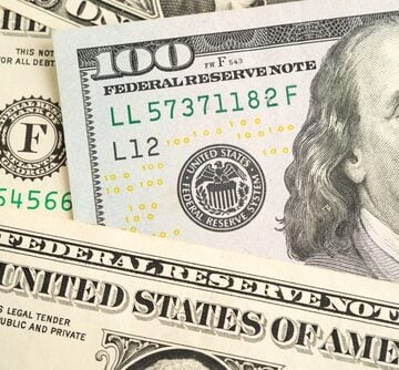 Close-up of U.S. $100 Federal Reserve notes featuring the portrait of Benjamin Franklin. Close-up of U.S. $100 Federal Reserve notes featuring the portrait of Benjamin Franklin.