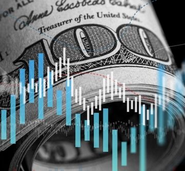 Close-up of a rolled-up U.S. 100-dollar bill overlaid with glowing blue and white financial trading charts and candlestick graphs. Close-up of a rolled-up U.S. 100-dollar bill overlaid with glowing blue and white financial trading charts and candlestick graphs.