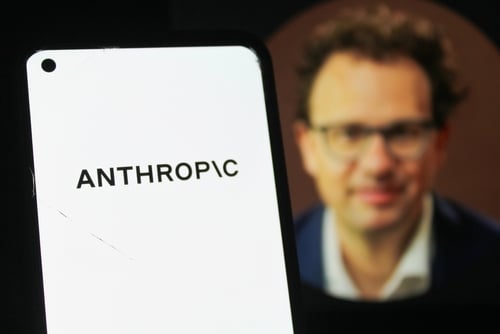 The Anthropic logo on a mobile phone in front of a blurred image of its co-founder and CEO, Dario Amodei. The Anthropic logo on a mobile phone in front of a blurred image of its co-founder and CEO, Dario Amodei.