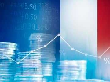 Concept image of French national economy, combining the French flag with stock market charts, percentage signs, and stacks of coins. Concept image of French national economy, combining the French flag with stock market charts, percentage signs, and stacks of coins.
