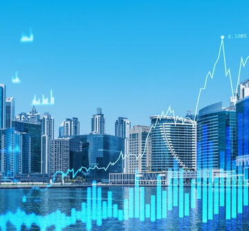 A double-exposure conceptual graphic of the Dubai skyline overlaid with a digital Forex trading chart and financial data. A double-exposure conceptual graphic of the Dubai skyline overlaid with a digital Forex trading chart and financial data.