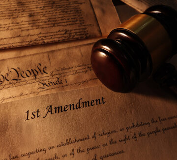 First,Amendment,And,Us,Constitution,Text,With,Legal,Gavel MORE THREATS TO THE FREEDOM OF SPEECH