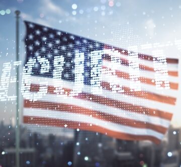 A digital graphic of the U.S. flag overlaid with the word "SECURITY" and binary code against a city skyline. A digital graphic of the U.S. flag overlaid with the word "SECURITY" and binary code against a city skyline.