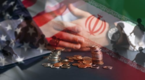 Concept image depicting U.S. and Iranian flags, a handshake, and stacked coins or currency. Concept image depicting U.S. and Iranian flags, a handshake, and stacked coins or currency.