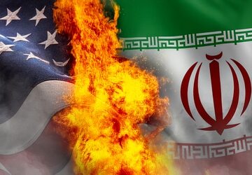 American,And,Iranian,Flags,Covered,In,Smoke,And,Fire.,The IRAN’S FORMER TOP DIPLOMAT ISSUES WW III WARNING IF U.S. USES NUKES