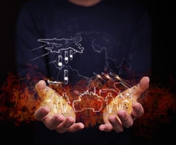 Conceptual digital graphic depicting global warfare and military conflict with glowing outlines of military assets – including a bomber aircraft dropping bombs, missiles, a tank, and soldiers – hovering above a burning world map cradled in human hands. Conceptual digital graphic depicting global warfare and military conflict with glowing outlines of military assets – including a bomber aircraft dropping bombs, missiles, a tank, and soldiers – hovering above a burning world map cradled in human hands.