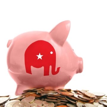 Piggy,Bank,And,Pile,Of,Coins,With,Republican,Party,Elephant REPUBLICANS PREPARE TO SPEND $1B IN ADS BEFORE CRUCIAL MIDTERM ELECTIONS