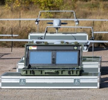 The image shows an H10 Poseidon reconnaissance drone system and its dual-screen mobile control station packed in specialized transport cases, photographed in the Kyiv region of Ukraine in September 2022.