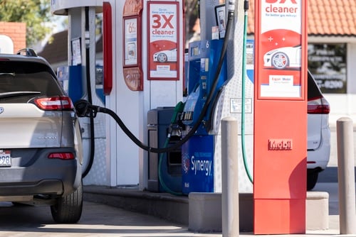 The photo shows a vehicle refueling at a Mobil gas station. The photo shows a vehicle refueling at a Mobil gas station.