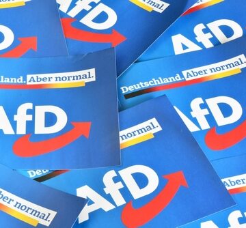 A pile of campaign materials and flyers for the Alternative for Germany (AfD), a far-right populist political party in Germany. A pile of campaign materials and flyers for the Alternative for Germany (AfD), a far-right populist political party in Germany.
