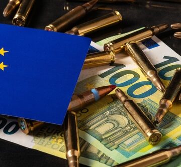 The image shows rifle cartridges scattered across 100-euro banknotes next to the flag of the European Union.