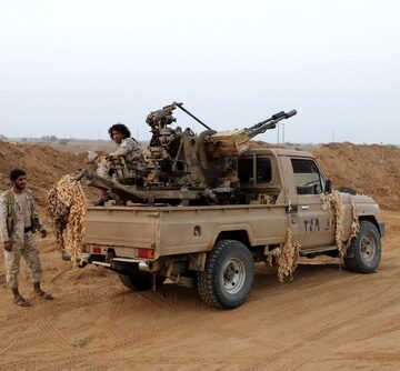 An improvised fighting vehicle, commonly called a technical, featuring a light utility pickup truck with an open-terrain, anti-aircraft twin-barrel autocannon, appearing to be a ZPU-2 system mounted in the truck bed. An improvised fighting vehicle, commonly called a technical, featuring a light utility pickup truck with an open-terrain, anti-aircraft twin-barrel autocannon, appearing to be a ZPU-2 system mounted in the truck bed.