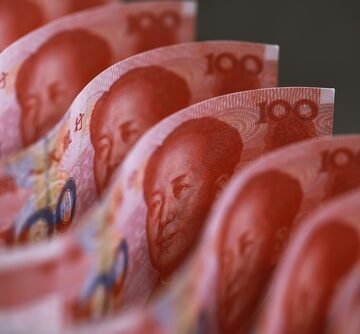 Close-up of 100-yuan Chinese Renminbi banknotes featuring the portrait of Mao Zedong. Close-up of 100-yuan Chinese Renminbi banknotes featuring the portrait of Mao Zedong.