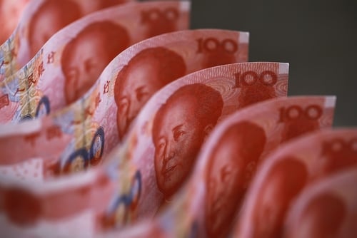 Close-up of 100-yuan Chinese Renminbi banknotes featuring the portrait of Mao Zedong. Close-up of 100-yuan Chinese Renminbi banknotes featuring the portrait of Mao Zedong.