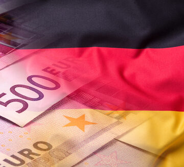 Euro banknotes (including a 500-euro note) overlaid with the German national flag. Euro banknotes (including a 500-euro note) overlaid with the German national flag.