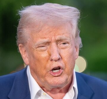 President Donald Trump speaking outdoors in a blue suit and white shirt. President Donald Trump speaking outdoors in a blue suit and white shirt.