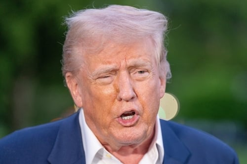 President Donald Trump speaking outdoors in a blue suit and white shirt. President Donald Trump speaking outdoors in a blue suit and white shirt.